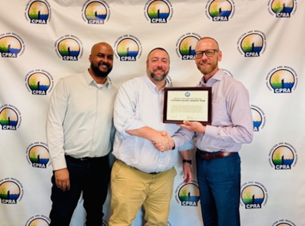 thumbnail of photo with award