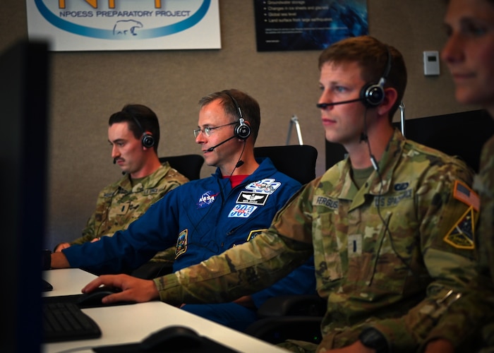 Image of Guardians working with computers.