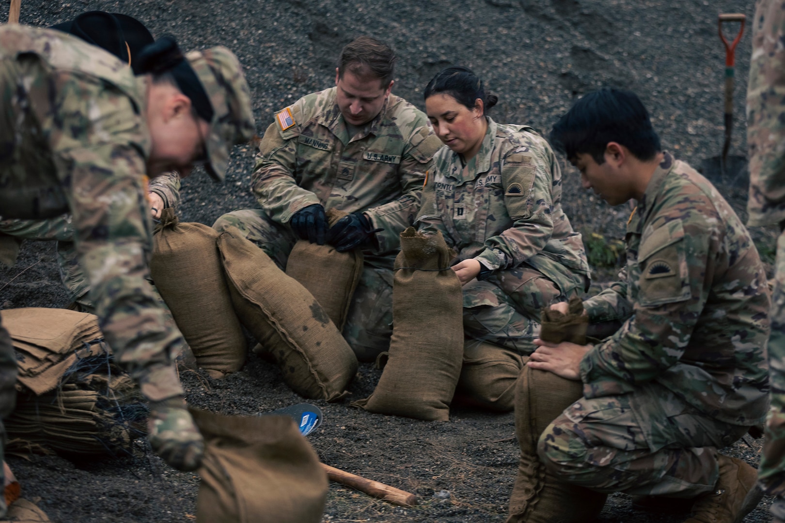 U.S. Army Soldiers from the 1st Squadron, 303rd Cavalry Regiment, 96th Troop Command, Washington Army National Guard fill sand bags in Sedro Woolley, Wash., Dec. 11, 2025