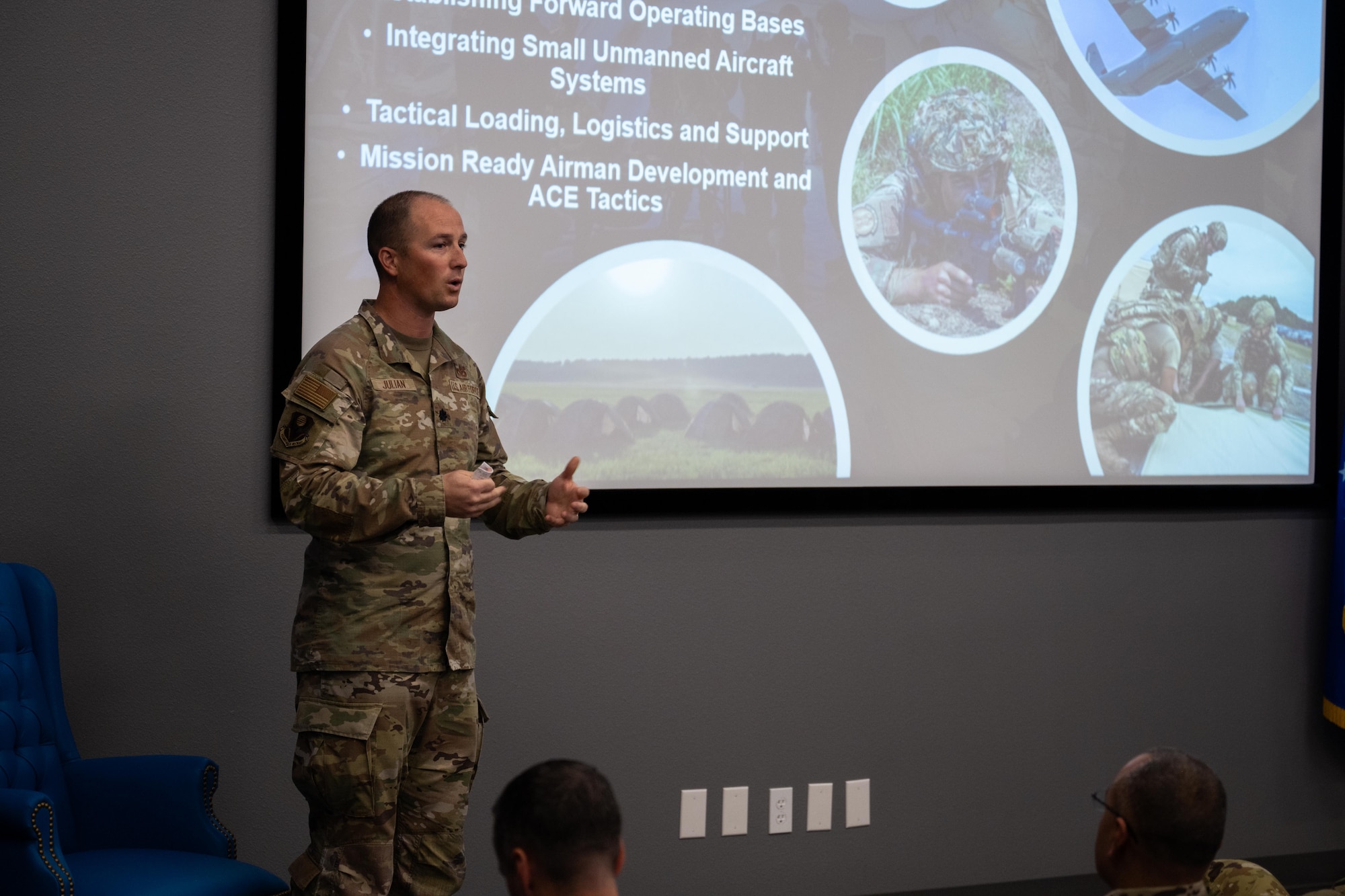 U.S. Air Force Lt. Col. Paul Julian, 21st Air Task Force deputy commander, speaks with Dyess honorary commanders and civic leaders during a townhall at Dyess Air Force Base, Texas, Dec. 17, 2025. The event provided Dyess leadership with the opportunity to highlight operational successes from the past year and discuss priorities for 2026. (U.S. Air Force photo by Airman 1st Class Adrien Tran)