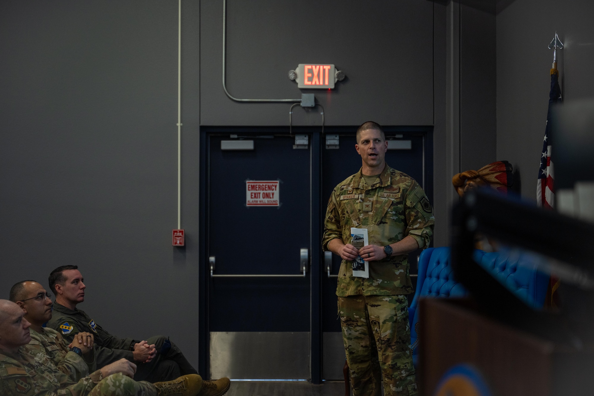 U.S. Air Force Col. Seth Spanier, 7th Bomb Wing commander, briefs Dyess honorary commanders and civic leaders during a townhall at Dyess Air Force Base, Texas, Dec. 17, 2025. Dyess leadership builds relationships between base leaders and community members to foster understanding, communication and support for the Airmen and families stationed at Dyess. (U.S. Air Force photo by Airman 1st Class Adrien Tran)
