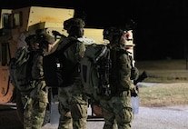 A photo of four Airmen participating in the Green Goblin exercise.