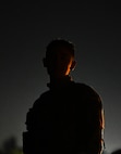 A silhouette of an Airman preparing for enemy recon.