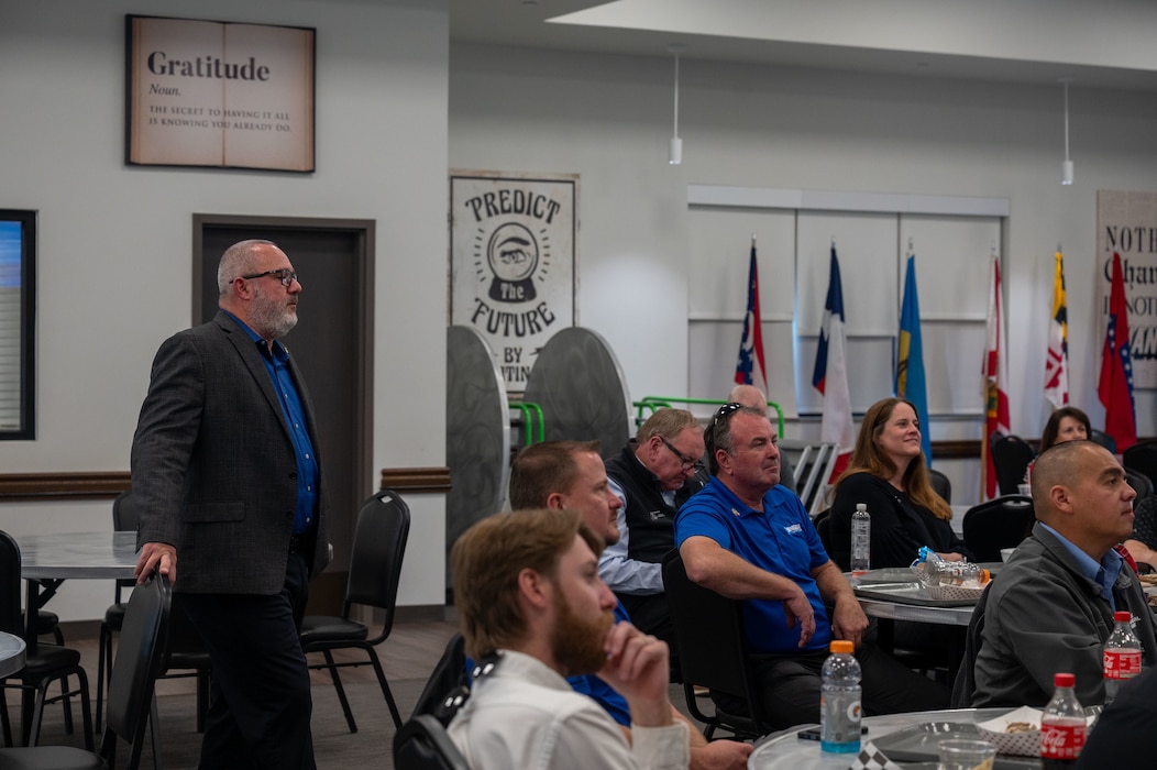 Dan Stein, 17th Training Wing director of staff and legislative liaison, briefs the honorary commanders at the Cressman Dining Facility, Goodfellow Air Force Base, Texas, Dec. 12, 2025. The HCC dined together and attended a series of briefings, such as USAF 101, an overview of the Honorary Commander Program, and a discussion on what trainees experience following basic military training.  (U.S. Air Force photo by Airman 1st Class James Salellas)