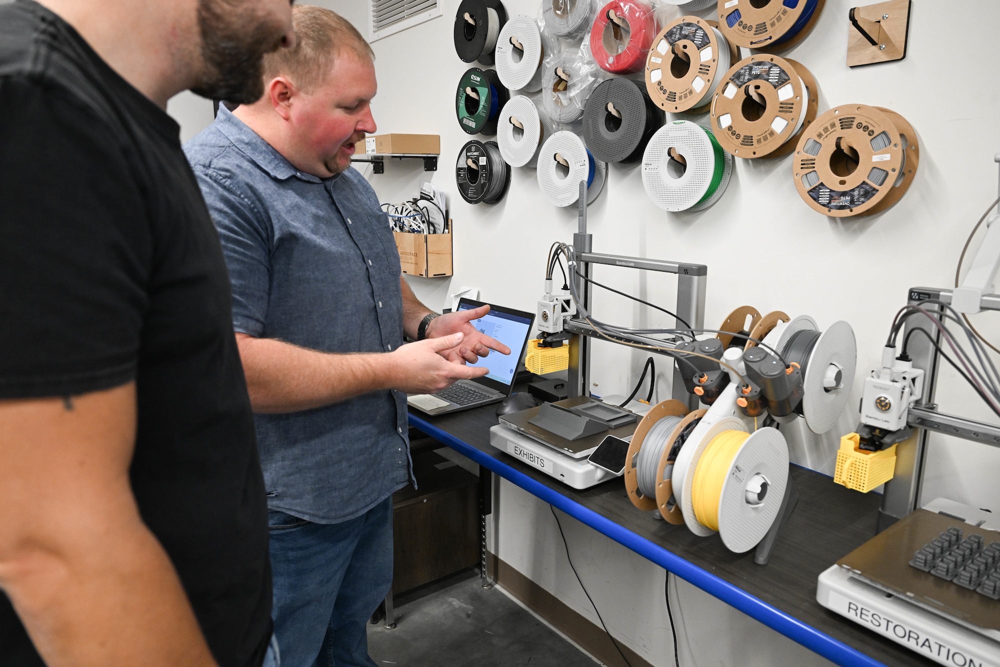 Museum restoration technicians with their 3D printer