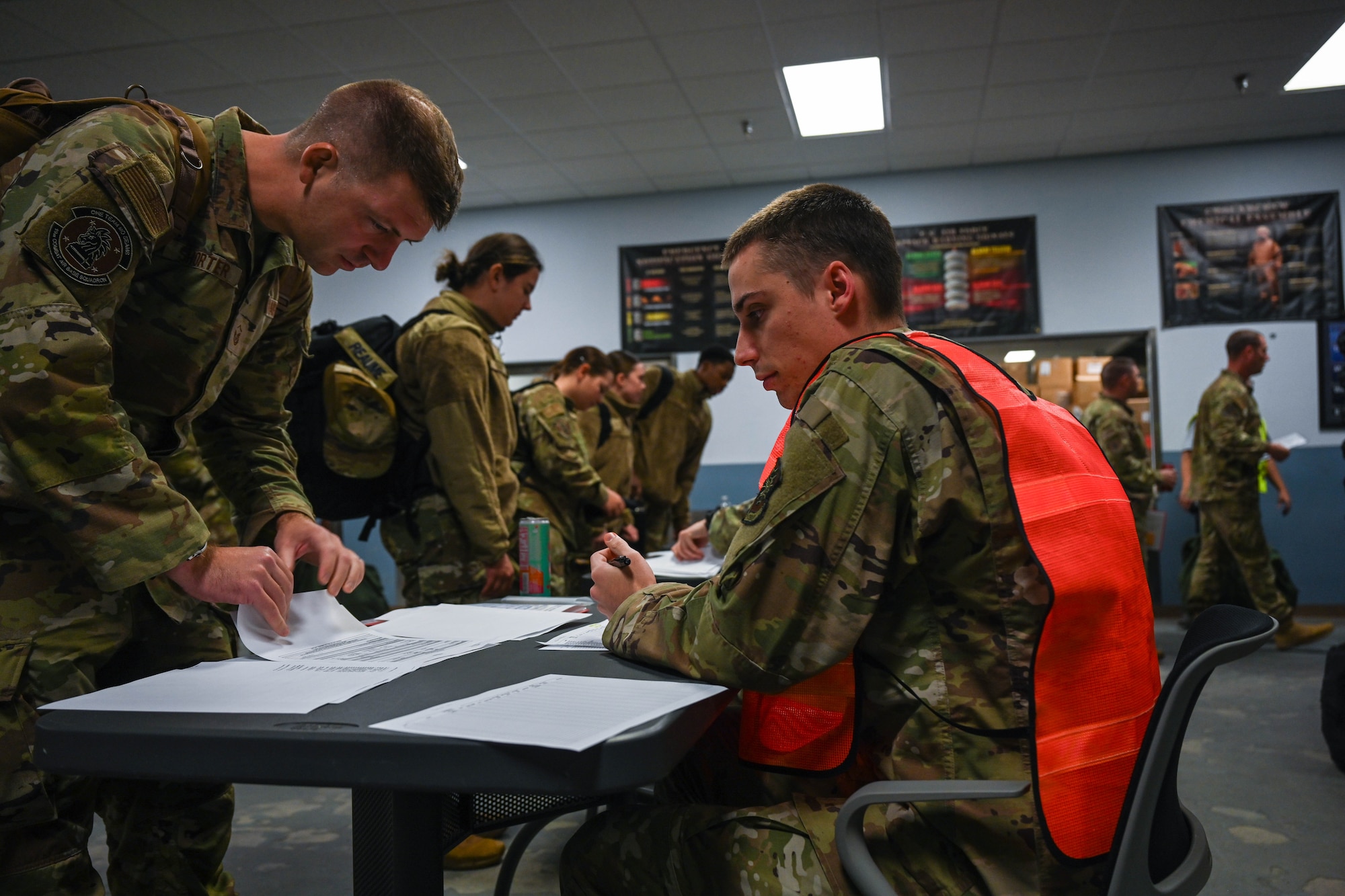 An Airman processes a simulated deployment line during an exercise.