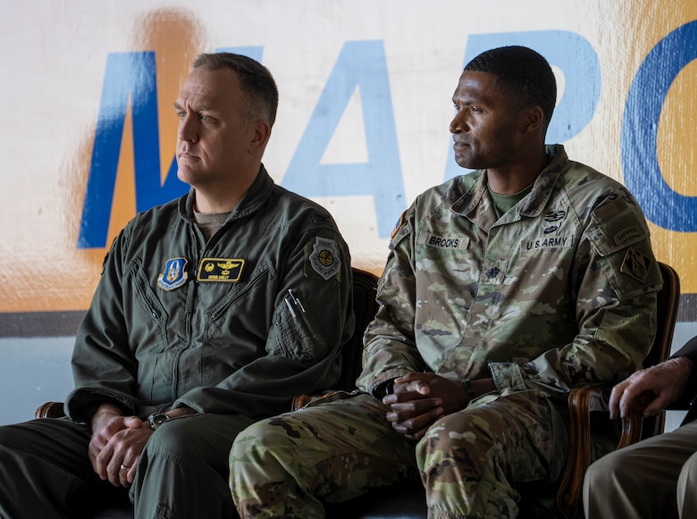 Lt. Col. Stephen Brooks, deputy commander of the U.S. Army Corps of Engineers Los Angeles District, right, sits with Col. Bryan Bailey, commander of the 452nd Air Mobility Wing, left, and other distinguished guests during the Dec. 16 groundbreaking ceremony for a new KC-46 Pegasus hangar and training facility.
