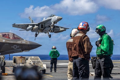 PHILIPPINE SEA (Dec. 16, 2025) — An F/A-18F Super Hornet, attached to Strike Fighter Squadron (VFA) 41, prepares to make an arrested landing on the flight deck of Nimitz-class aircraft carrier USS Abraham Lincoln (CVN 72) on Dec. 16, 2025. The...