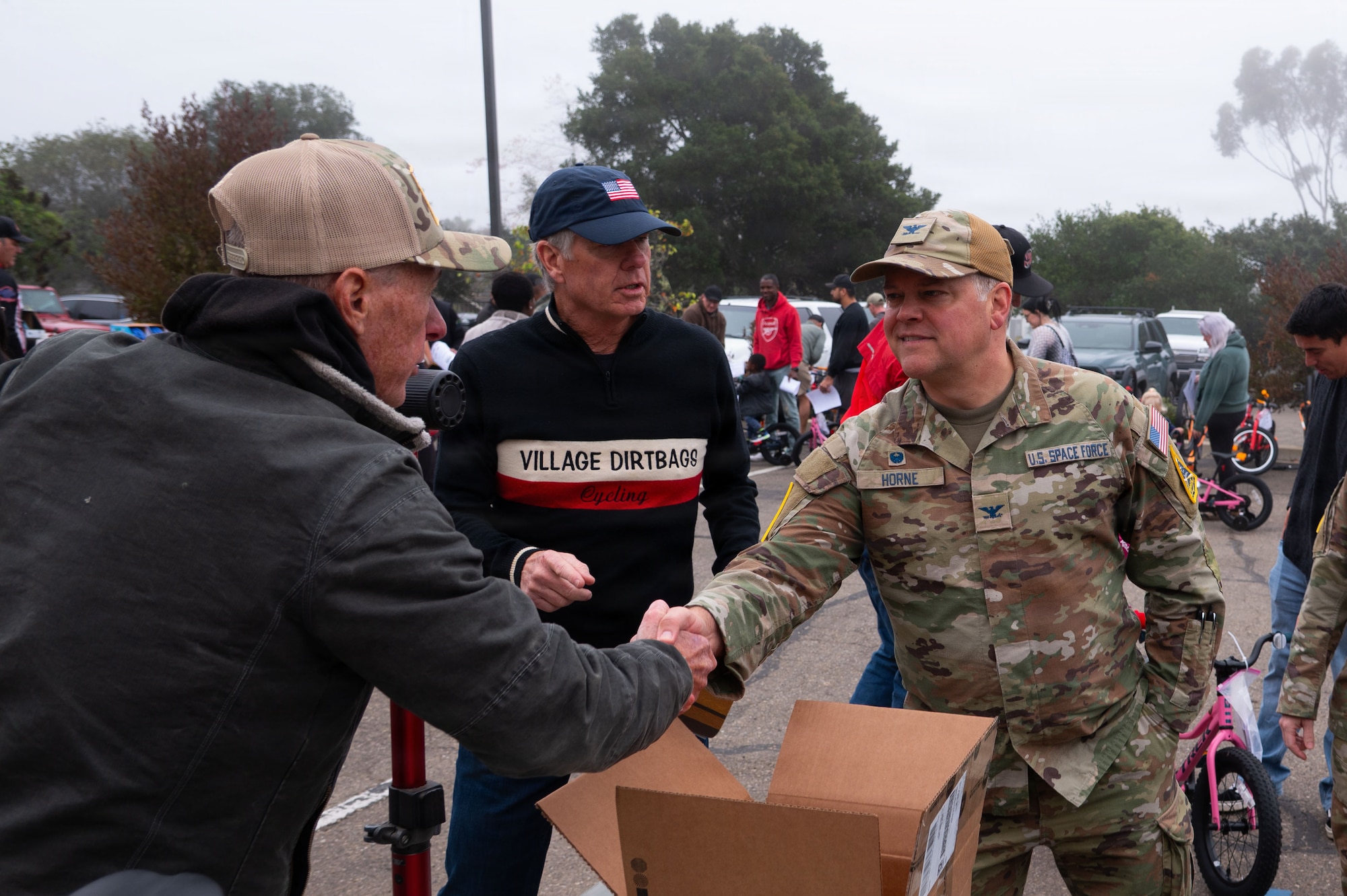 two people shake hands