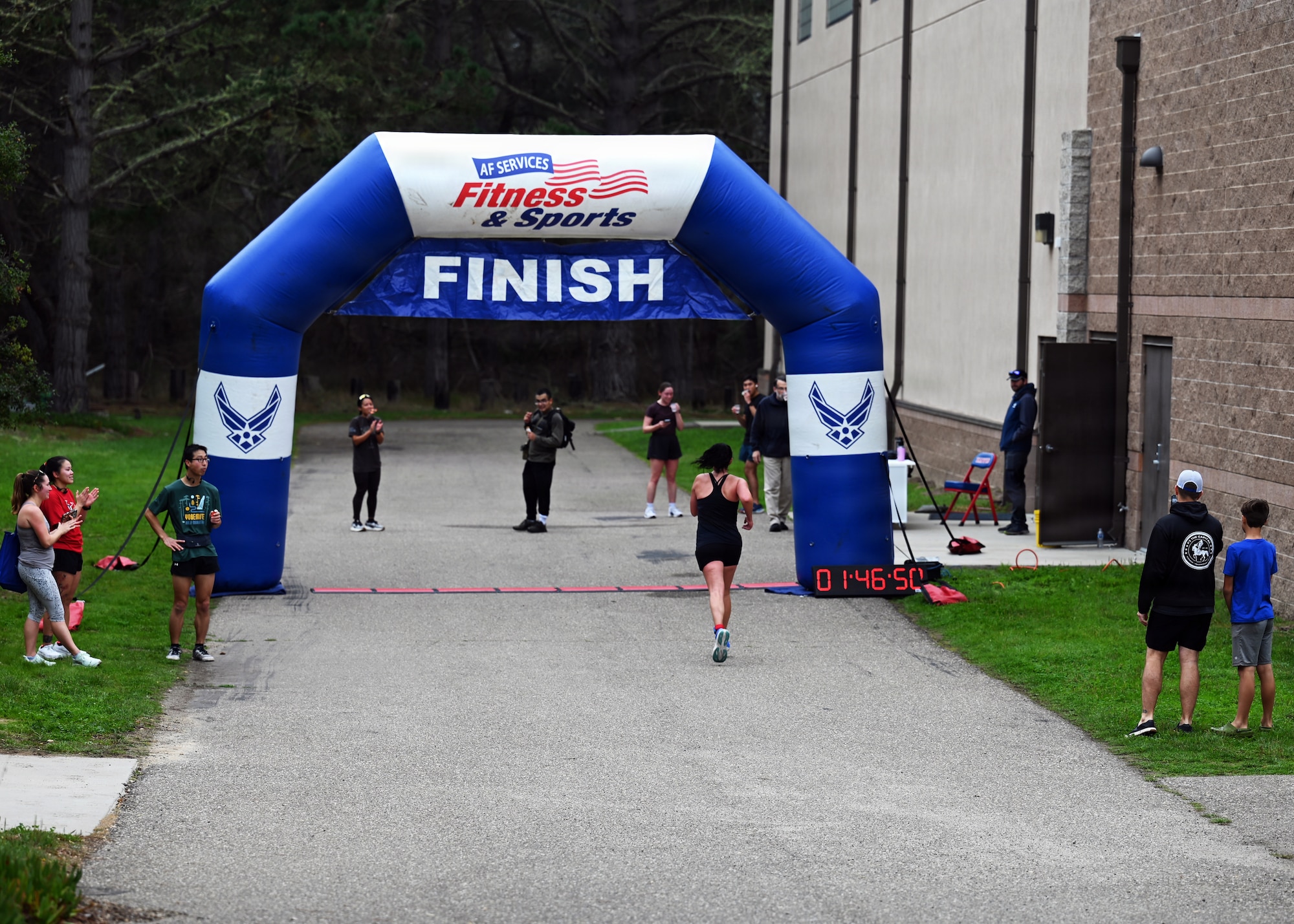 A participant crosses the finish line during the localized T-Minus 10-Miler at Vandenberg Space Force Base