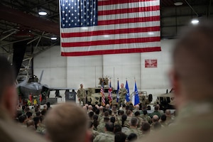 Air Force Chief of Staff Gen. Ken Wilsbach and Chief Master Sgt. of the Air Force David Wolfe address the room of 48th Fighter Wing airmen during a visit to RAF Lakenheath, England, Dec.19, 2025.