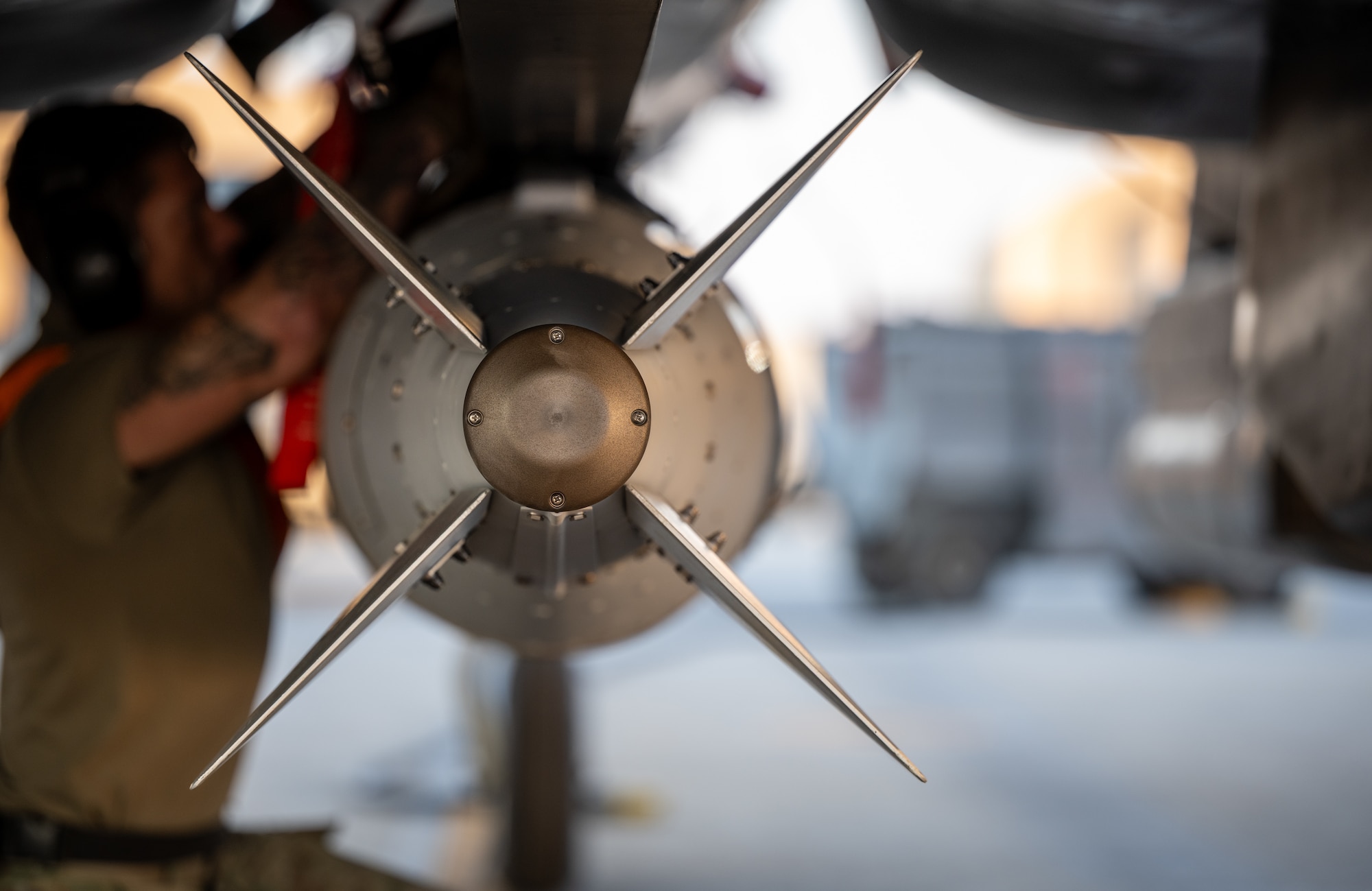 a GBU-31 munition system is loaded onto an F-15E Strike Eagle