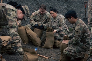 U.S. Army Soldiers from the 1st Squadron, 303rd Cavalry Regiment, 96th Troop Command, Washington Army National Guard fill sand bags in Sedro Woolley, Wash., Dec. 11, 2025