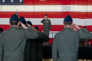 Commander renders first salute to formation.
