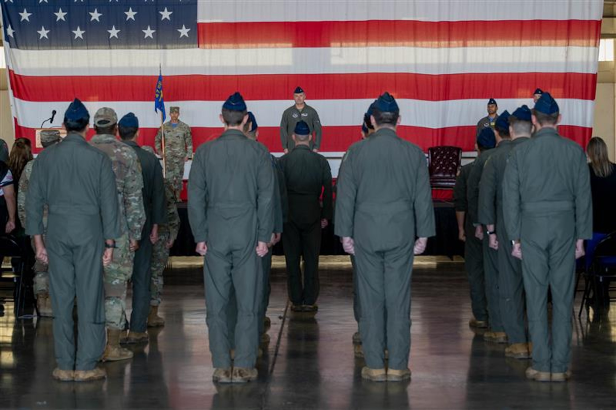 Airmen stand in formation.