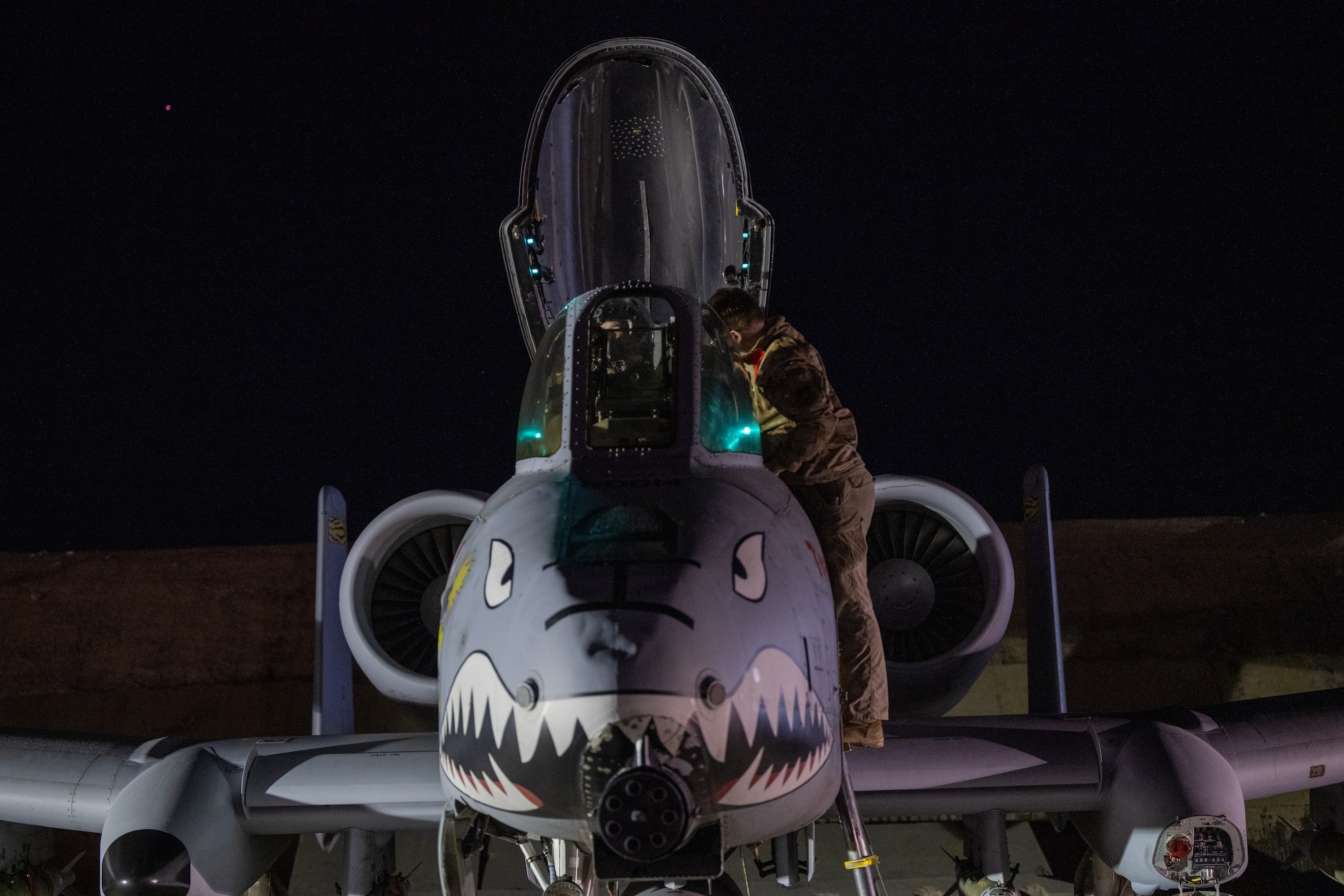 A U.S. Airman prepares an A-10 Thunderbolt II for flight from a base in the U.S. Central Command area of responsibility, Dec. 19, in support of Operation Hawkeye Strike.