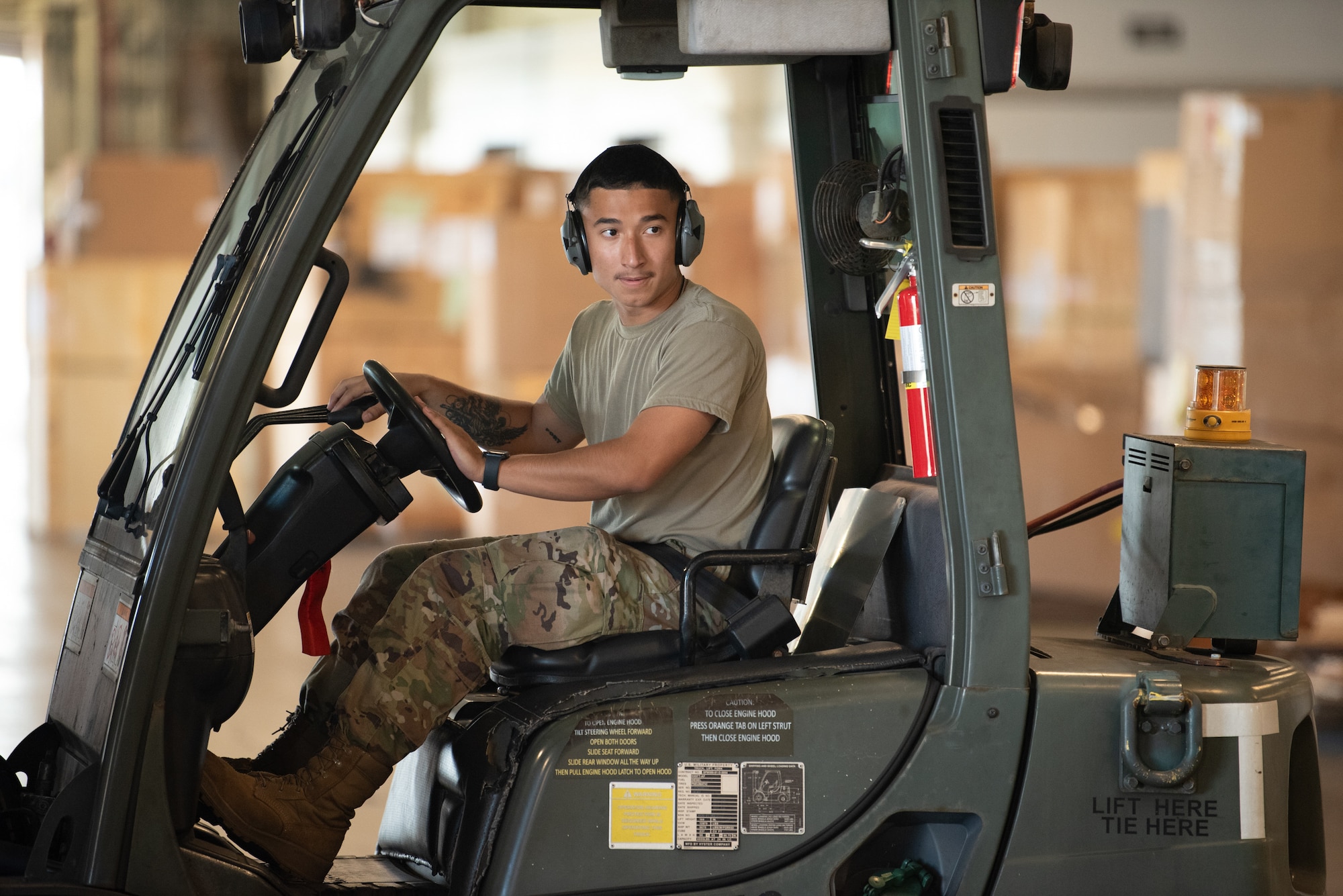 Airman First Class Joshua Plaza, an aerial porter from the Kentucky Air National Guard’s 123rd Logistics Readiness Squadron, moves pallets in a cargo warehouse at Joint Base Pearl Harbor-Hickam, Hawaii, on July 30, 2025. Plaza was among more than 70 personnel from the Louisville-based 123rd Airlift Wing to conduct annual training here over 14 days, sharpening skills that enhance their employment as Multi-Capable Airmen. (U.S. Air National Guard photo by Phil Speck)