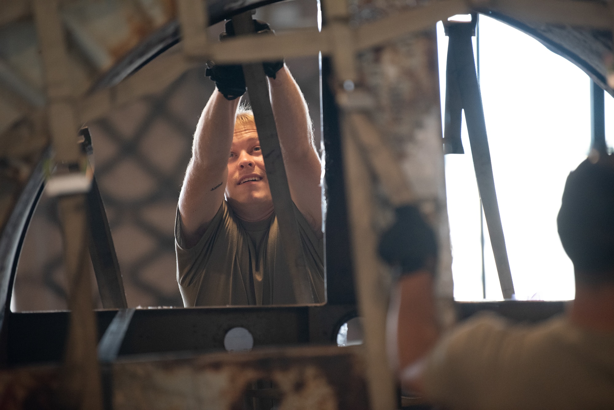 Airman First Class Cole Davidson, an aerial porter from the Kentucky Air National Guard’s 123rd Logistics Readiness Squadron, tightens straps on a pallet at a cargo warehouse at Joint Base Pearl Harbor-Hickam, Hawaii, on July 30, 2025. Davidson among more than 70 personnel from the Louisville-based 123rd Airlift Wing to conduct annual training here over 14 days, sharpening skills that enhance their employment as Multi-Capable Airmen. (U.S. Air National Guard photo by Phil Speck)