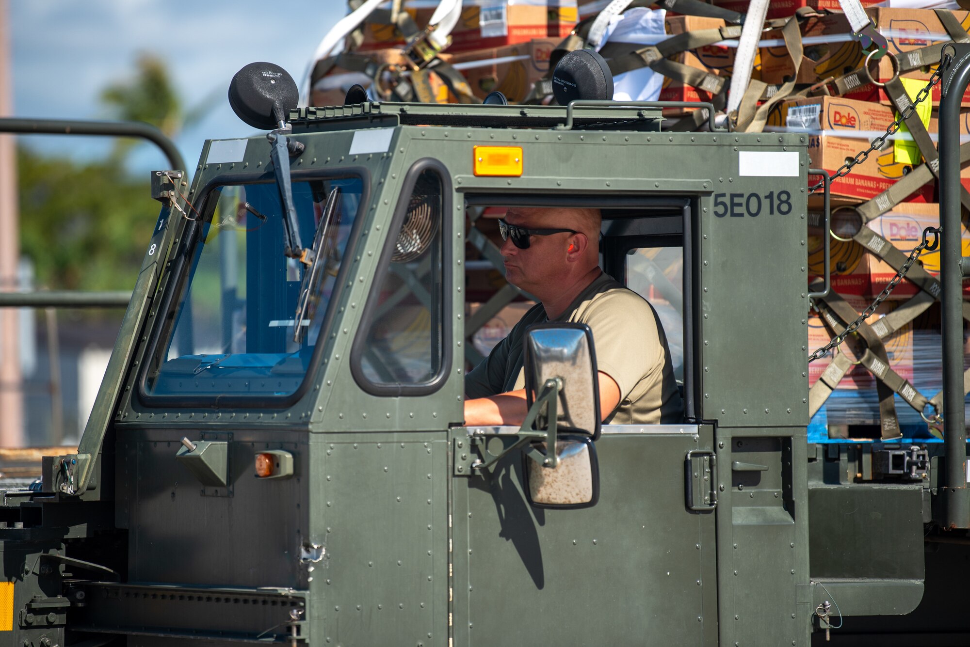 Master Sgt. Jerome Noltemeyer, an aerial porter from the Kentucky Air National Guard's 123rd Logistics Readiness Squadron, drives a cargo loader at Joint Base Pearl Harbor-Hickam, Hawaii, on Aug. 4, 2025. Noltemeyer was among more than 70 personnel from the Louisville-based 123rd Airlift Wing to conduct annual training here over 14 days, sharpening skills that enhance their employment as Multi-Capable Airmen. (U.S. Air National Guard photo by Phil Speck)
