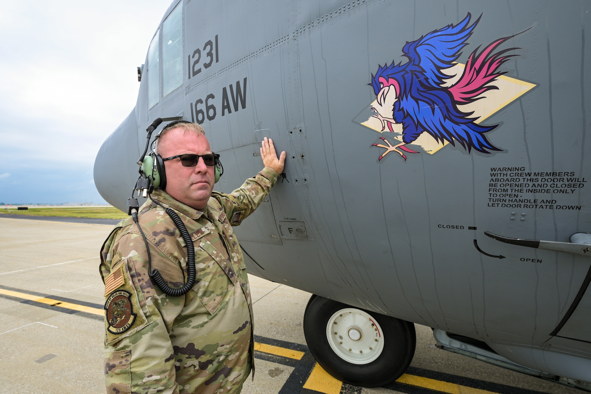 Master Sgt. Matt Killen, an aircraft crew chief assigned to the 123rd Airlift Wing, welcomes home a historic C-130H Hercules to the Kentucky Air National Guard Base in Louisville, Ky., Sept. 22, 2025. The 33-year-old transport, tail number 11231, began its career with the wing in 1992 after arriving straight from the Lockheed-Martin factory as the 2,000th C-130 ever produced. Originally named Man o’ War in honor of the famous thoroughbred racehorse, the aircraft was reassigned to the Delaware Air Guard in 2021. More than three decades and millions of miles later, the plane is now being retired at its original Kentucky home, where it will be placed on static display with restored livery bearing the original name. (U.S. Air National Guard photo by Dale Greer)