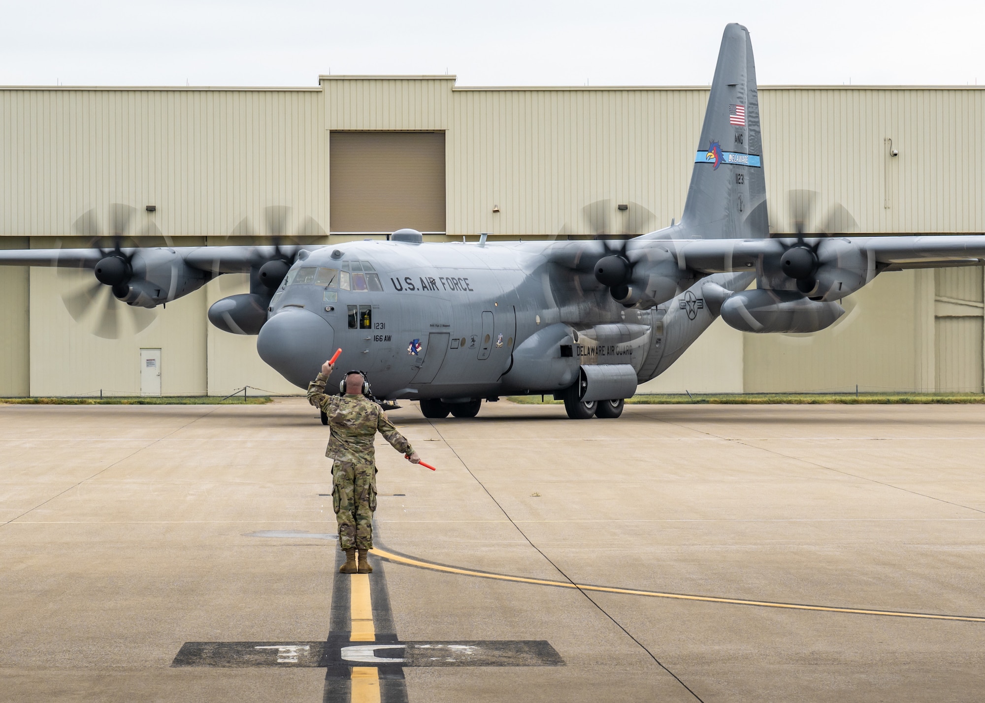 A historic C-130H Hercules taxies onto the flight line at the Kentucky Air National Guard Base in Louisville, Ky., Sept. 22, 2025, ending the 33-year-old transport’s final flight. The plane, which has flown millions of miles around the world over the past three decades, initially was assigned to the Kentucky Air Guard’s 123rd Airlift Wing straight from the Lockheed-Martin factory in 1992 before being reassigned to the Delaware Air Guard in 2021, when the Louisville unit began transitioning to the new C-130J Super Hercules. Named after the famous thoroughbred racehorse “Man o’ War” during its time in Kentucky, tail number 11231 was the 2000th C-130 to roll off the assembly line. It will now be placed on static display for retirement at its original Kentucky home, complete with restored livery and its unique Man o’ War markings. (U.S. Air National Guard photo by Dale Greer)