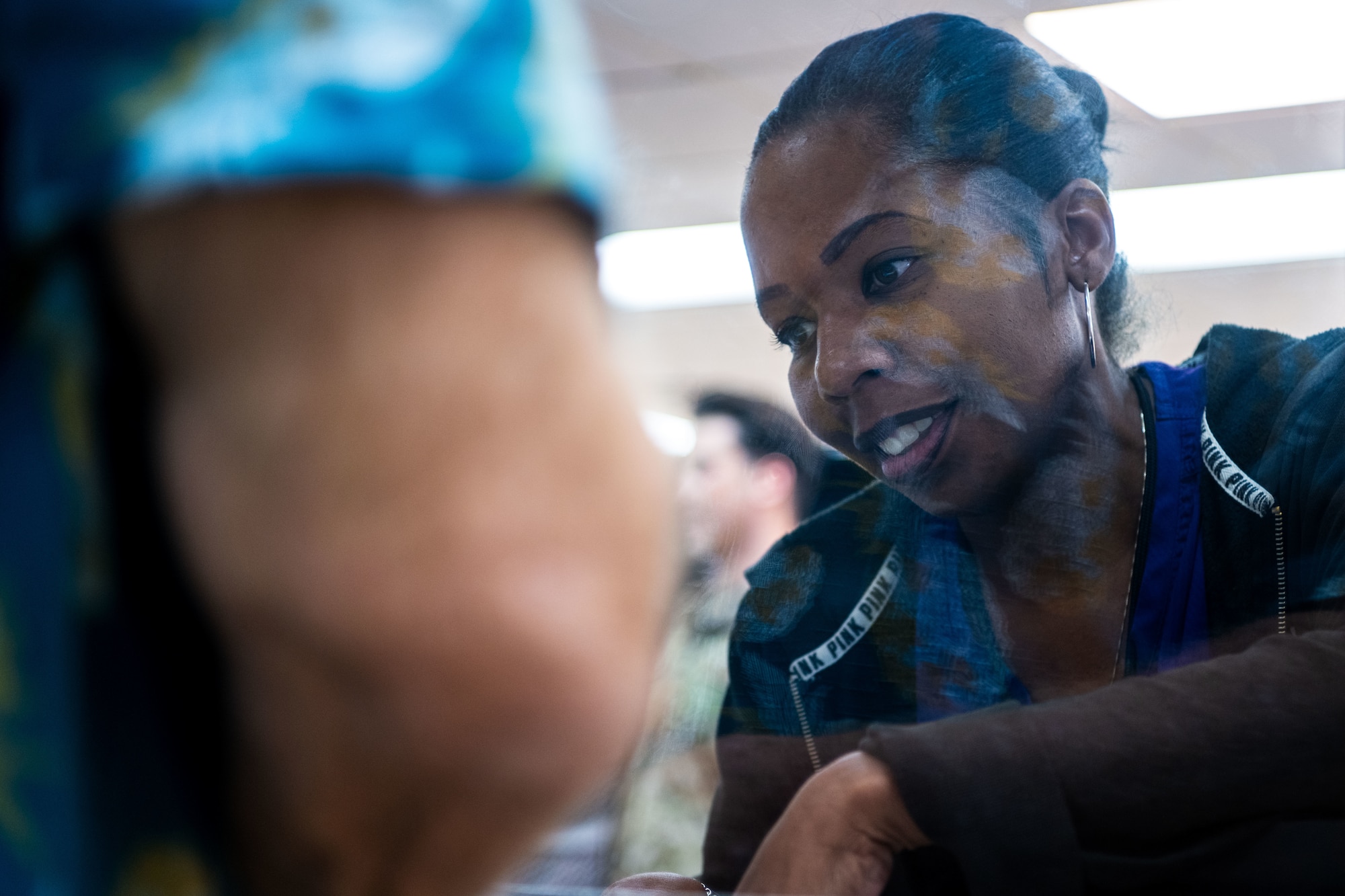 Kenzier McIntyre, 6th Medical Support Squadron pharmacist, assists a customer at MacDill Air Force Base, Florida, Oct. 20, 2025. The 6th MDSS pharmacy employs a wide range of staff including active duty service members, contractors, government civilians and local students. (U.S. Air Force photo by Senior Airman Zachary Foster)