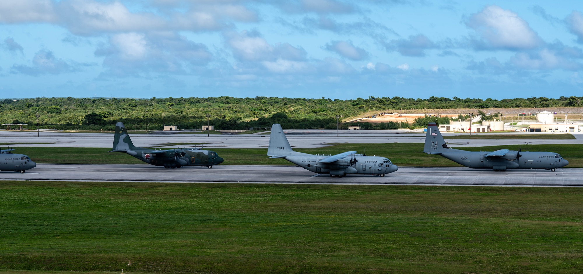 A formation of C-130J Super Hercules and C-130H Hercules aircraft from the U.S. Air Force, Japan Air Self-Defense Force and Republic of Korea Air Force taxi.
