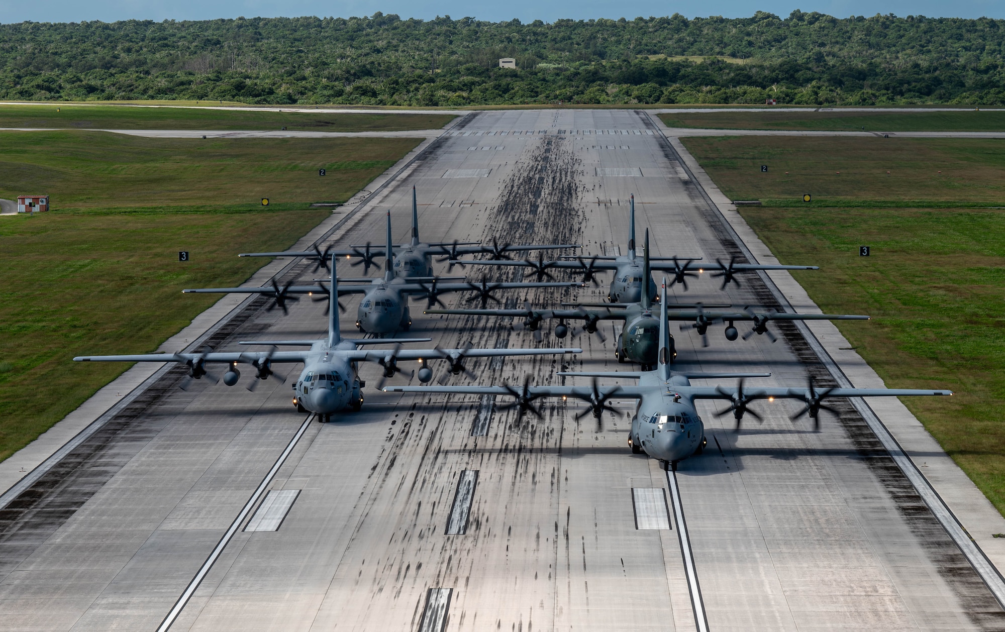 A formation of C-130J Super Hercules and C-130H Hercules aircraft from the U.S. Air Force, Japan Air Self-Defense Force and Republic of Korea Air Force participate in an elephant walk.
