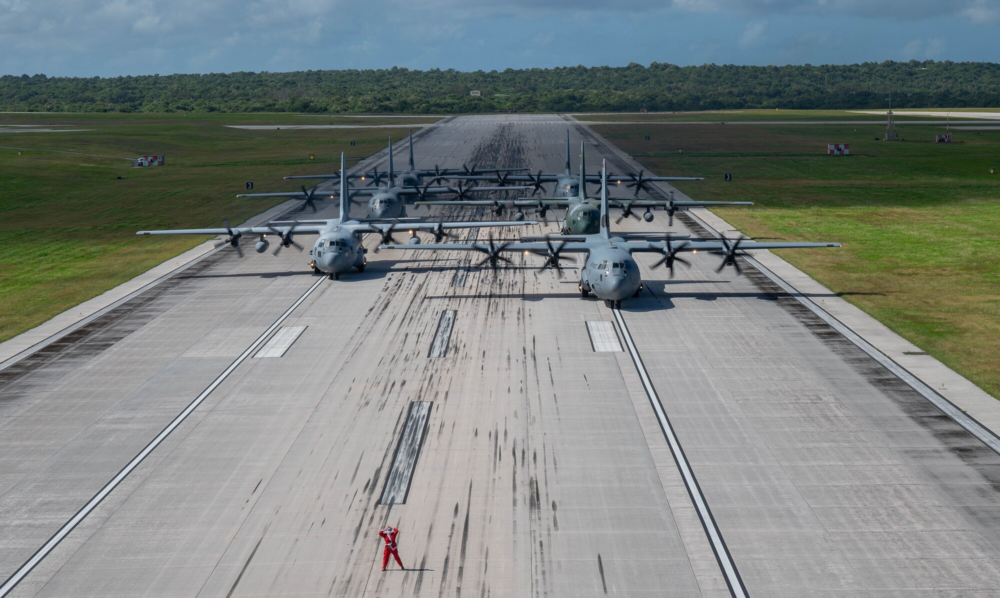 A formation of C-130J Super Hercules and C-130H Hercules aircraft from the U.S. Air Force, Japan Air Self-Defense Force and Republic of Korea Air Force taxi.