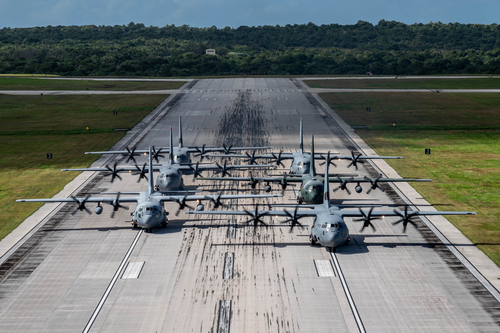 A formation of C-130J Super Hercules and C-130H Hercules aircraft from the U.S. Air Force, Japan Air Self-Defense Force and Republic of Korea Air Force taxi.