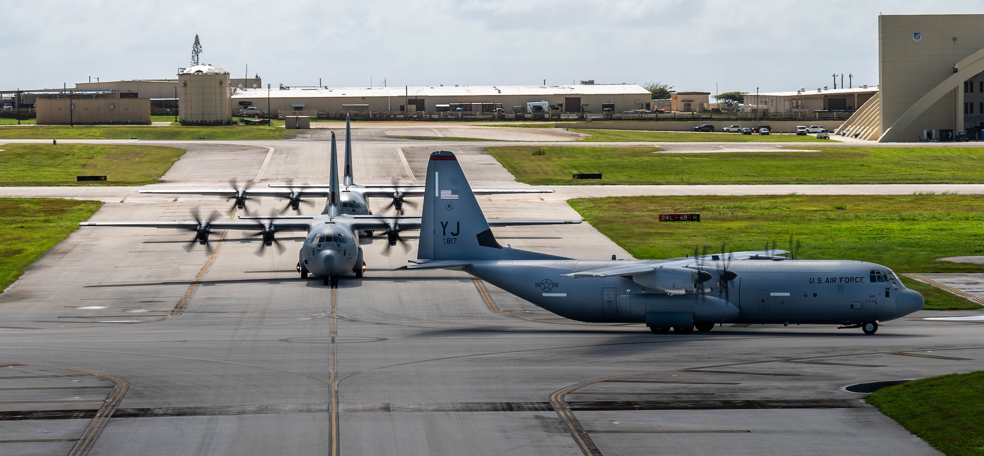 A formation of C-130J Super Hercules and C-130H Hercules aircraft from the U.S. Air Force, Japan Air Self-Defense Force and Republic of Korea Air Force taxi into position.