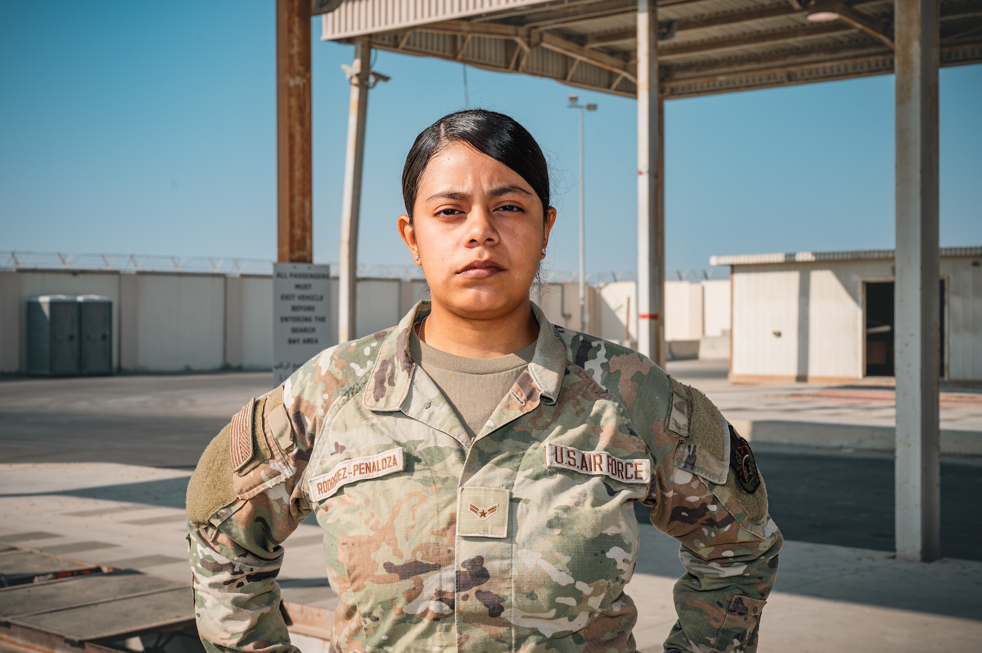 woman stands in uniform