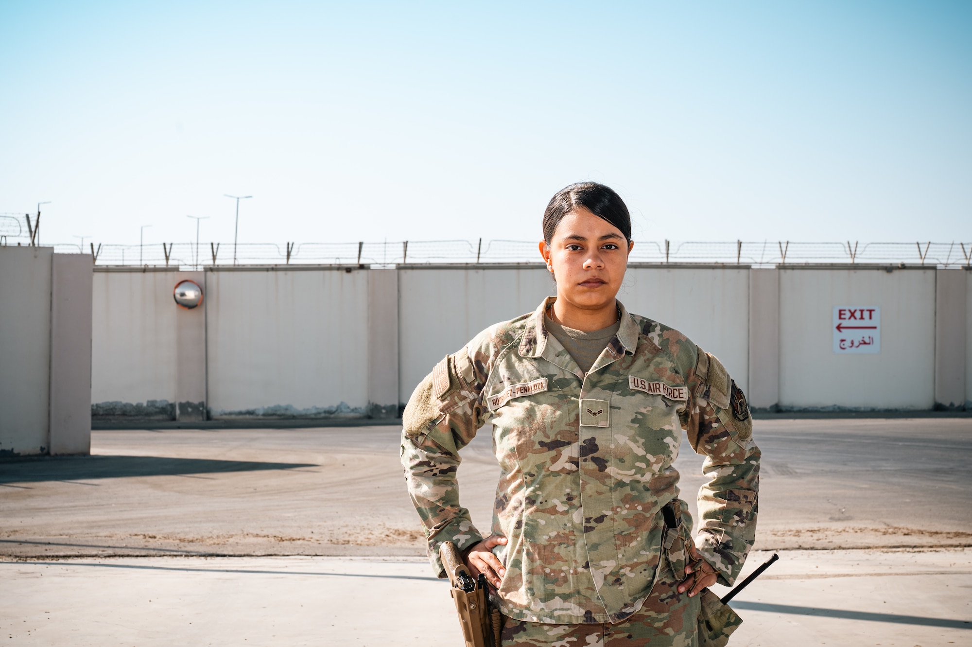 woman stands in uniform