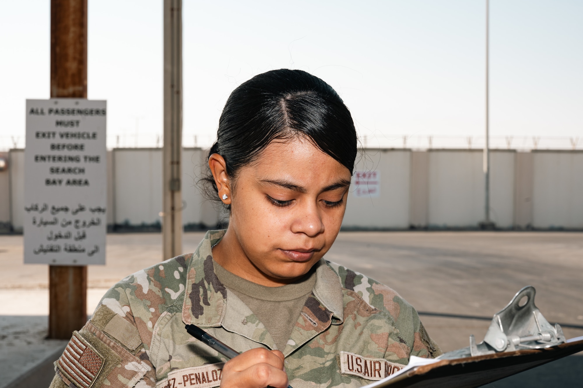 woman stands in uniform