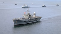 The command ship USS Mount Whitney sails in formation with other U.S. and NATO warships in the Baltic Sea.