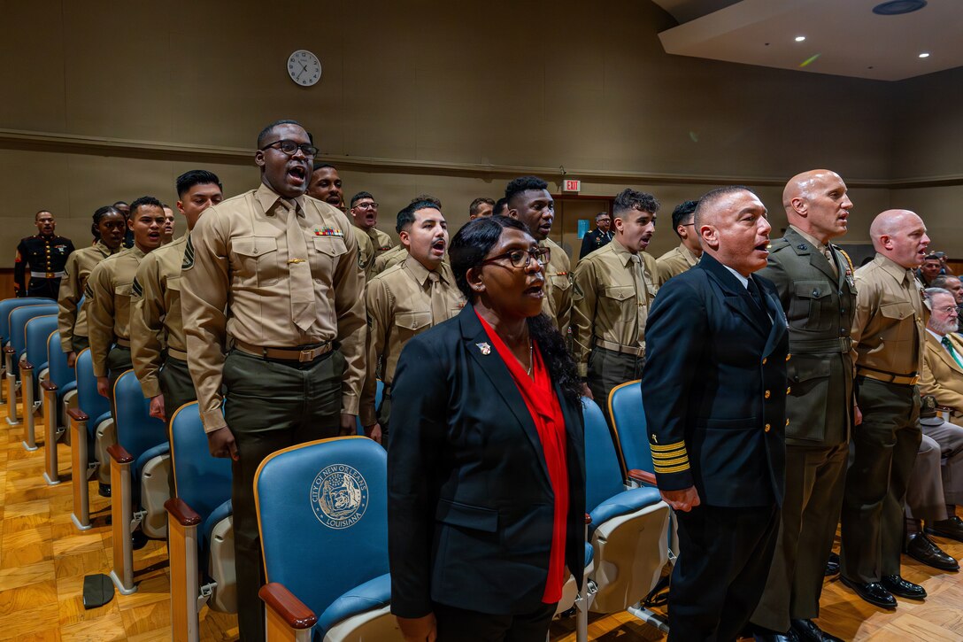 Marines with Marine Forces Reserve and Marine Forces South sing the Marine’s Hymn during a military appreciation day at the New Orleans City Hall, New Orleans, Dec. 18, 2025. The event was held to honor the New Orleans City Council's relationship with U.S. military officials, highlighting key recognitions such as Veteran of the Year, major accomplishments from each military branch across the city and the council’s appreciation for the service of U.S. military members. (U.S. Marine Corps photo taken by Sgt. Aaron TorresLemus)