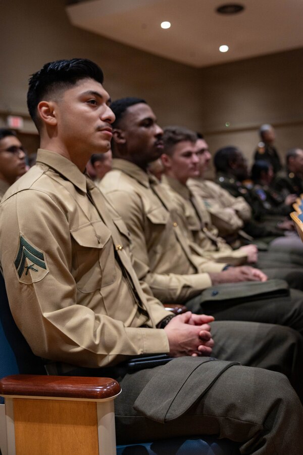 U.S. Marine Corps Cpl. Victor VillaToro sits in the audience during a military appreciation event at New Orleans City Hall, New Orleans, Dec. 18, 2025. The event was held to honor the New Orleans City Council’s relationship with U.S. military officials, highlighting key recognitions such as Veteran of the Year, major accomplishments from each military branch across the city and the council’s appreciation for the service of U.S. military members. (U.S. Marine Corps photo by Lance Cpl. Claire Cheney)