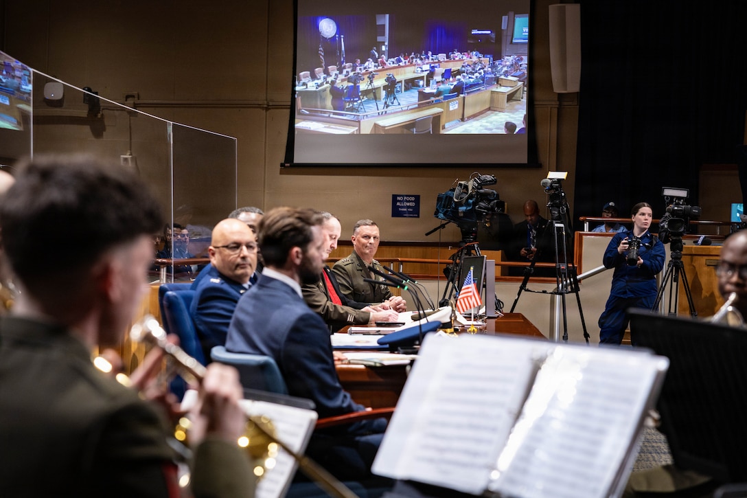 U.S. Marine Corps Lt. Gen. Leonard F. Anderson IV (center) listens to the Marine Forces Reserve Band as they perform during a military appreciation day at New Orleans City Hall, New Orleans, Dec. 18, 2025. The event was held to honor the New Orleans City Council’s relationship with U.S. military officials, highlighting key recognitions such as Veteran of the Year, major accomplishments from each military branch across the city and the council’s appreciation for the service of U.S. military members. (U.S. Marine Corps photo by Lance Cpl. Claire Cheney)