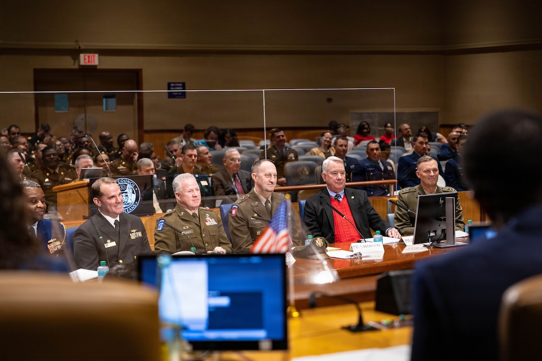 U.S. military officials from throughout New Orleans sit in front of their host, the New Orleans City Council, to commemorate a military appreciation day at New Orleans City Hall, New Orleans, Dec. 18, 2025. The event was held to honor the New Orleans City Council’s relationship with U.S. military officials, highlighting key recognitions such as Veteran of the Year, major accomplishments from each military branch across the city and the council’s appreciation for the service of U.S. military members. (U.S. Marine Corps photo by Lance Cpl. Claire Cheney)