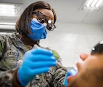 251120-N-OV429-2001 PORTSMOUTH, N.H. (Nov. 20, 2025) - Lt. Cmdr. Opeyemi Elizabeth Fadoju seen performing dental surgery. A native of Baltimore, MD, whose family emigrated to the United States from Lagos, Nigeria when she was 4, has earned multiple academic degrees, including a doctor of dental surgery in 2017. (U.S. Navy photo by Lt. Sydney Wall).
