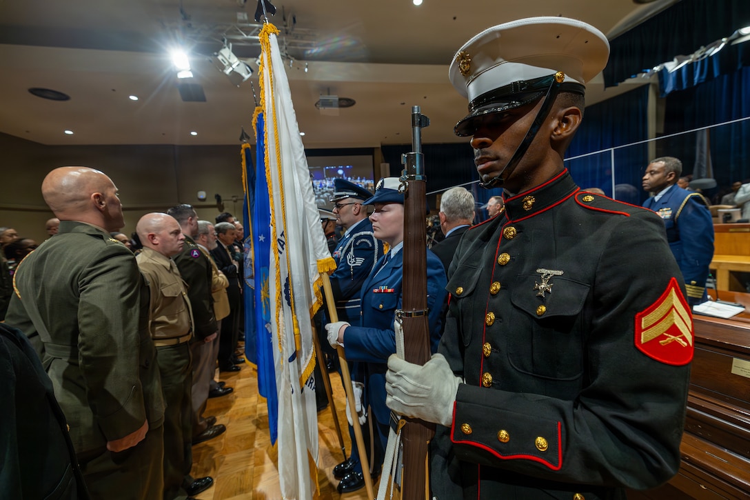 U.S. Marine Corps Cpl. Kenneth Johnson presents the colors during a military appreciation day at the New Orleans City Hall, New Orleans, Dec. 18, 2025. Johnson, a legal clerk with Headquarters Battalion, Marine Forces Reserve, was one of many service members in attendance to honor the New Orleans City Council's relationship with U.S. military officials, highlighting key recognitions such as Veteran of the Year, major accomplishments from each military branch across the city and the council’s appreciation for the service of U.S. military members. (U.S. Marine Corps photo taken by Sgt. Aaron TorresLemus)