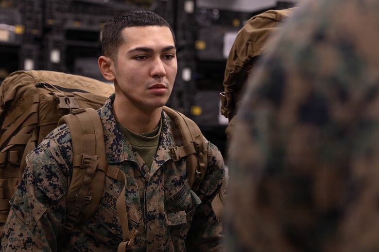 U.S. Marine Corps Lance Cpl. Charlie Rosado waits in line to get his gear list signed during a gear issue at Fort Devens, Massachusetts, Dec. 14, 2025. Rosado is a grenadier with Charlie Company, 1st Battalion, 25th Marine Regiment. Marines took part in this event as an ongoing effort to prepare and maintain readiness for upcoming training and operations. (U.S. Marine Corps photo by Lance Cpl. Priscilla Flores)