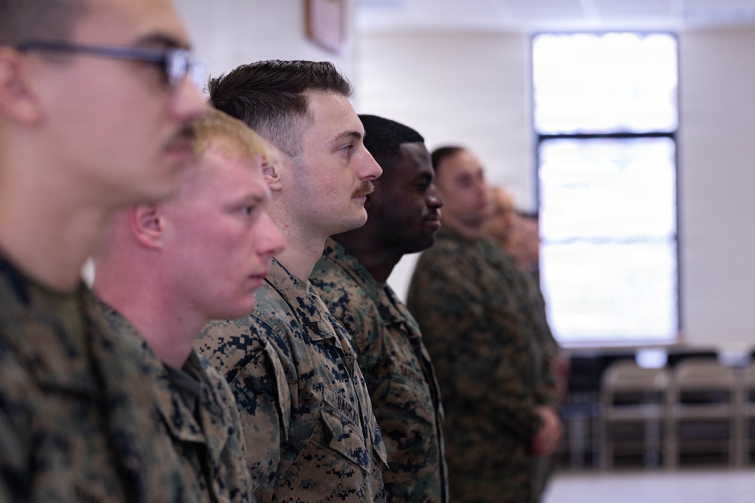 U.S. Marine Corps instructors with 1st Battalion, 25th Marine Regiment, wait for the Lance Corporal Leadership and Ethics Seminar and Corporals Course graduating ceremony to begin at Fort Devens, Massachusetts, Dec. 14, 2025. These courses focused on leadership development, ethical decision-making and enhancing professional skills to prepare Marines for increased responsibilities. (U.S. Marine Corps photo by Lance Cpl. Priscilla Flores)