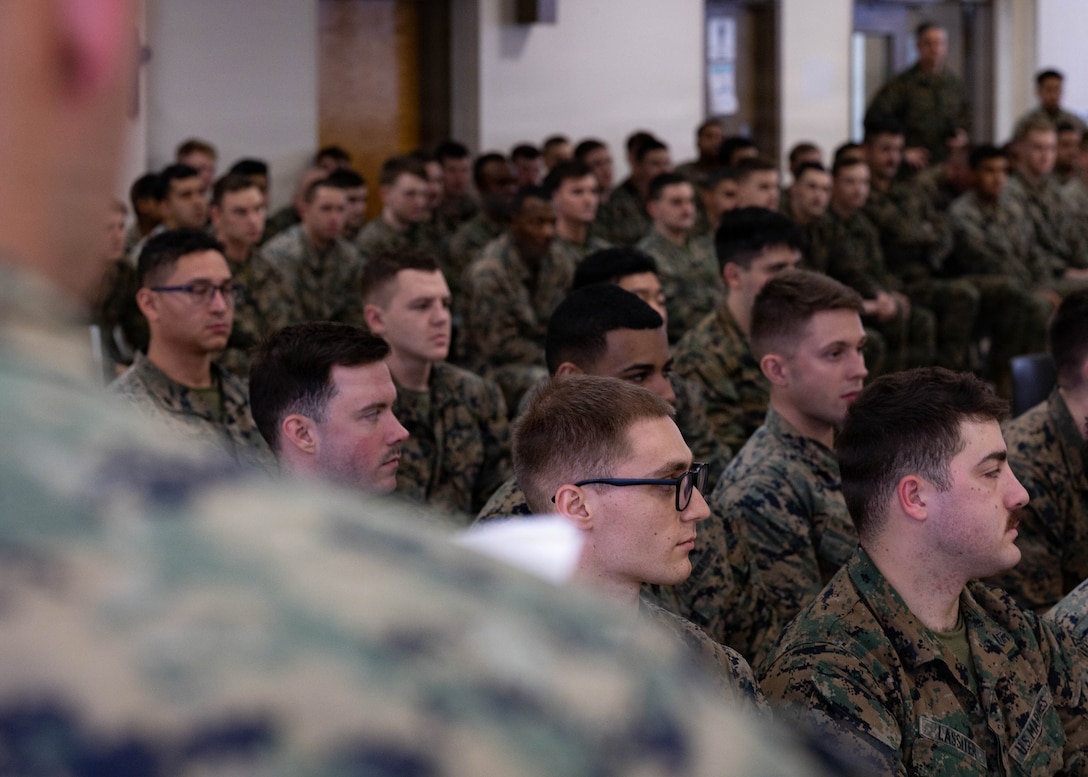 U.S. Marines with 1st Battalion, 25th Marine Regiment wait to receive their certificates for graduating Lance Corporal Leadership and Ethics Seminar and Corporals Course at Fort Devens, Massachusetts, Dec. 14, 2025. These courses focused on leadership development, ethical decision-making and enhancing professional skills to prepare Marines for increased responsibilities. (U.S. Marine Corps photo by Lance Cpl. Priscilla Flores)