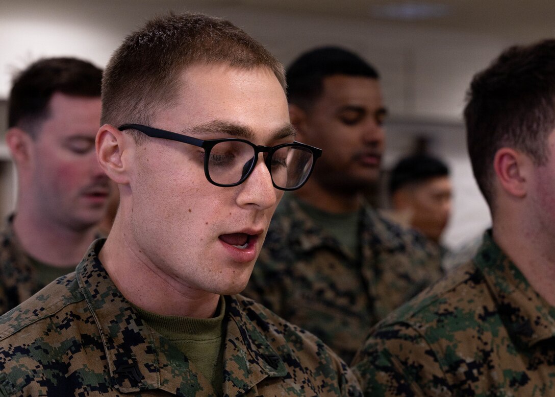 U.S. Marine Corps Cpl. Ethan Stefon recites the noncommissioned officer creed during the Lance Corporal Leadership and Ethics Seminar and Corporals Course graduation ceremony at Fort Devens, Massachusetts, Dec. 14, 2025. Stefon is a mortarman with Charlie Company, 1st Battalion, 25th Marine Regiment. These courses focused on leadership development, ethical decision-making and enhancing professional skills to prepare Marines for increased responsibilities. (U.S. Marine Corps photo by Lance Cpl. Priscilla Flores)