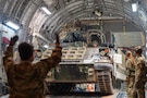 U.S. Airmen assigned to the 16th Expeditionary Airlift Squadron and U.S. Soldiers assigned to the 3rd Squadron, 278th Armored Cavalry Regiment offload an M2A3 Bradley Fighting Vehicle from a C-17 Globemaster III aircraft assigned to the 16th Expeditionary Airlift Squadron during a mission in the U.S. Central Command area of responsibility, Nov. 24, 2025. The 16th EAS directly supports the CENTCOM by moving personnel and cargo across thousands of miles in the AOR, enabling joint operations in air, land, and sea. (U.S. Air Force photo by Airman 1st Class Travis Knauss)