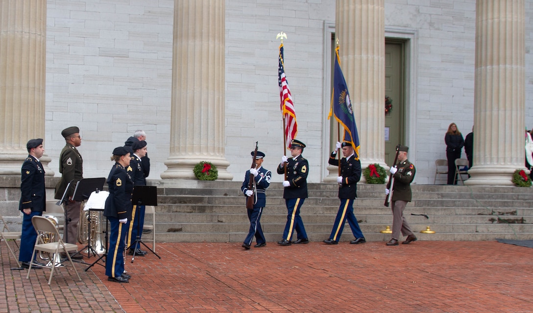 A joint color guard of Soldiers and an Airman from the Kentucky National Guard exits at the conclusion of a wreath laying ceremony, held at Kentucky's Old State Capitol in Frankfort, Dec. 11, 2025.