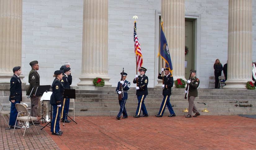 A joint color guard of Soldiers and an Airman from the Kentucky National Guard exits at the conclusion of a wreath laying ceremony, held at Kentucky's Old State Capitol in Frankfort, Dec. 11, 2025.