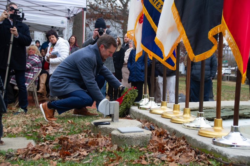 Kentucky Gov. Andy Beshear lays a wreath in honor of the U.S. Army during a ceremony at Kentucky's Old State Capitol in Frankfort, Dec. 11, 2025.
