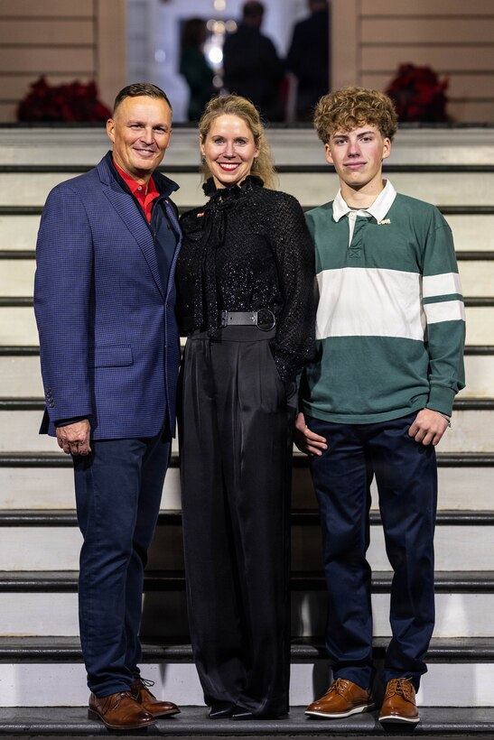 U.S. Marine Corps Lt. Gen. Leonard F. Anderson IV, commander of Marine Forces Reserve and Marine Forces South, poses for a family photo at the annual Christmas party held at Quarters A in New Orleans, Dec. 6, 2025. The event supported the Marine Corps Reserve Toys for Tots program, with guests contributing donations throughout the evening, and featured a concert by the Marine Forces Reserve Band as its main attraction. (U.S. Marine Corps photo by Lance Cpl. Priscilla Flores)